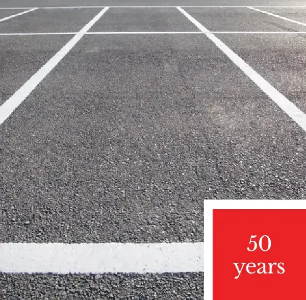 Empty parking lot with "50 years" text.